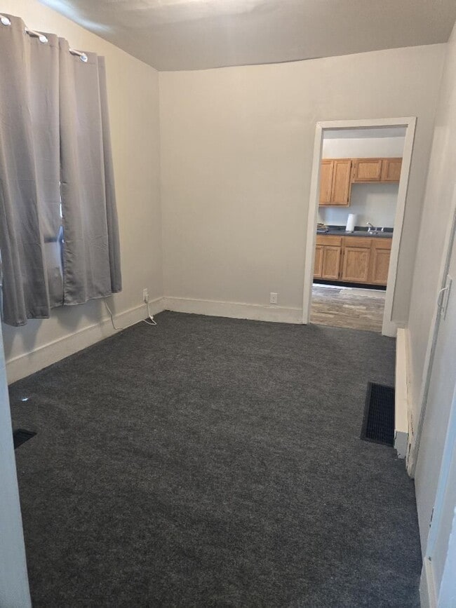 Bedroom with New Carpet - 437 E 9th St Unit A
