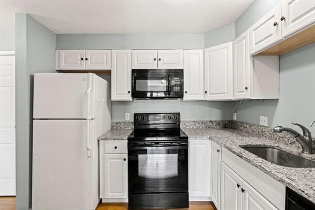 Photo - Updated 1BR Condo with Balcony, Garage Parking & Storage Near Commuter Rail Unit 101