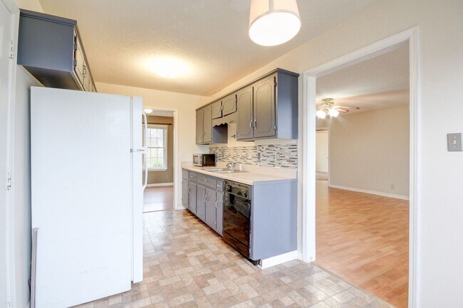 Photo - Amazing Home With Fireplace and Hardwood Flooring in Whitehall Subdivision