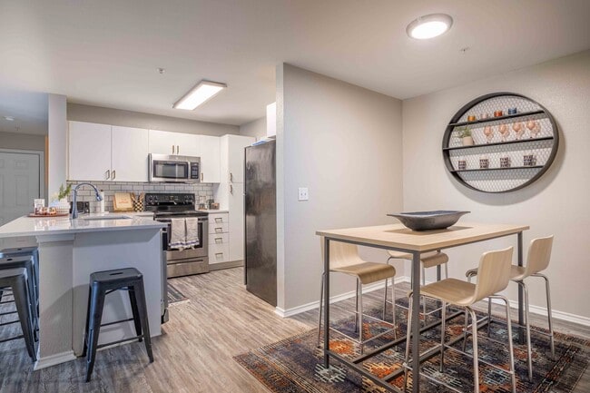 University-Trails-College-Station-Off-Campus-Apartments-Near-Texas-A&M-Furnished-Dining-Space-Upgraded-Kitchen - University Trails