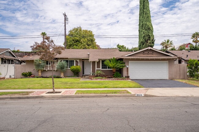 Building Photo - Charming Updated Home With Drive-Through Garage Access
