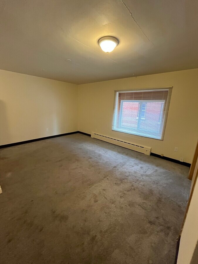 Living Room - carpet will be cleaned prior to move in - 8428 W Lisbon Ave Unit #1