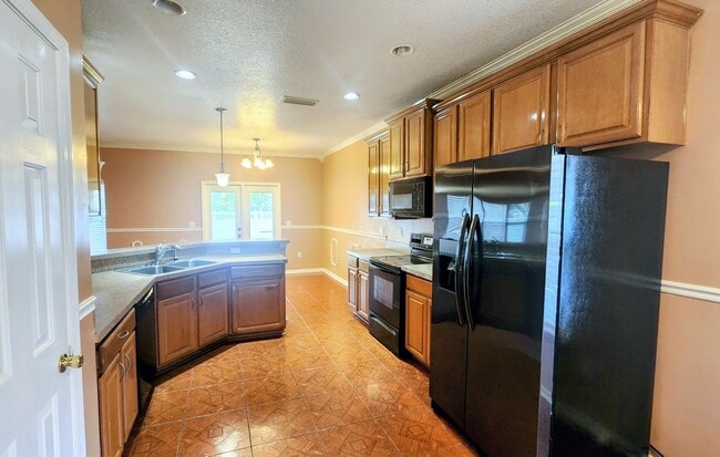 Photo - Spacious 4BR w/ Fenced Yard + Covered Lanai + 2 Car Garage in Orange Park!