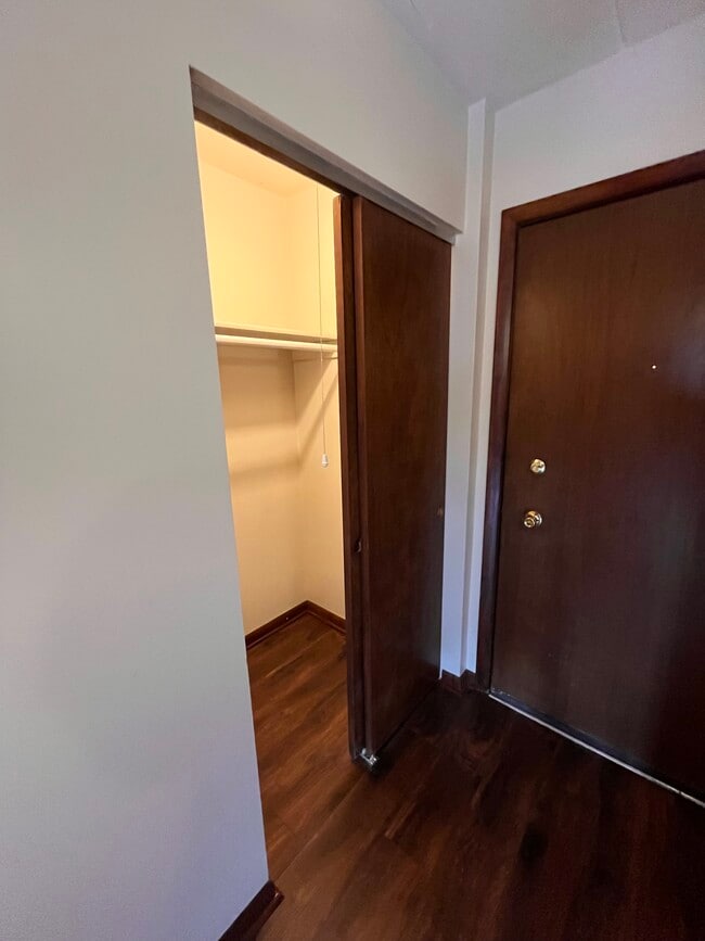 Guest closet in hall of unit - 10210 Washington Ave Unit 204