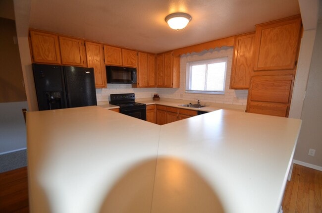 Photo - 4 bedroom home in Northglenn.  Newer paint with a large floor plan, wood floors & large deck for ...