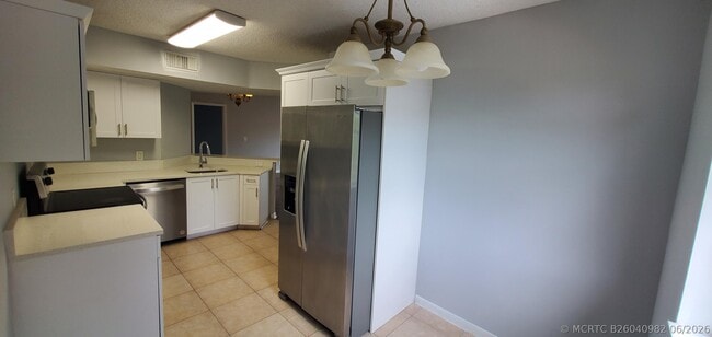 Building Photo - 9033 Wiles Rd Unit 308