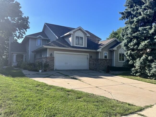 View from street - 1300 N High Point Rd Townhome