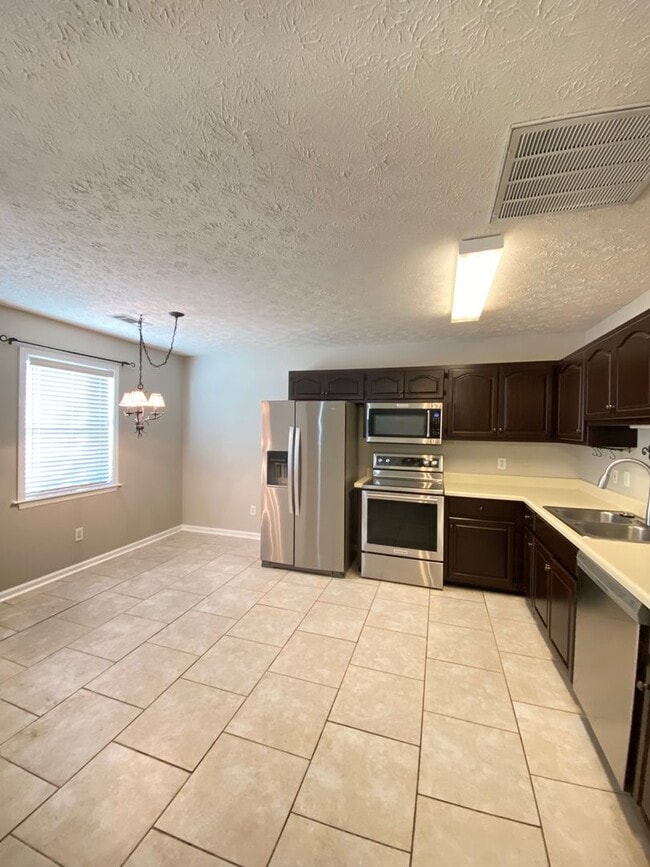 Photo - Updated 2BR/2BA Duplex with Fenced Yard & Lawn Care Included