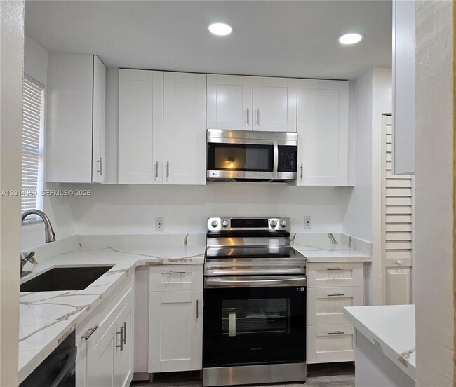 Building Photo - 11477 NW 39th Ct Unit 205-1