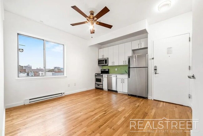Photo - Modern 2-Bedroom Apartment with Private Balcony in Prime Bushwick Unidad 5A