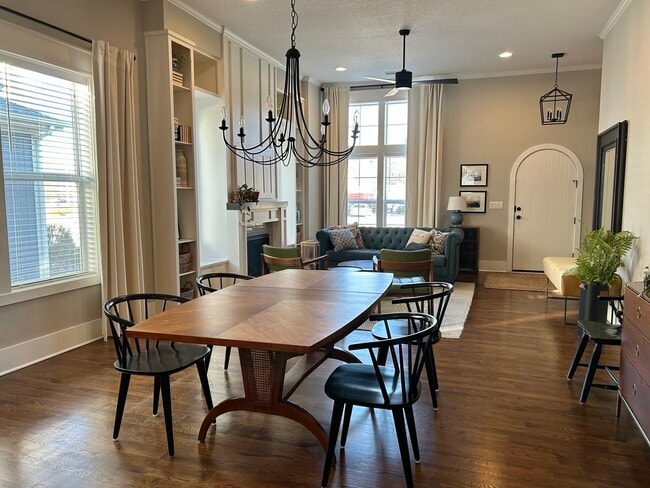 Spacious living/dining with vaulted ceiling and gas fireplace - 405 E 32nd Ave