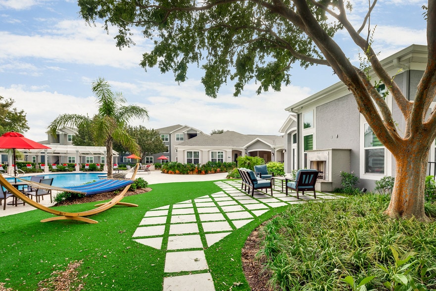 Bahia Cove Apartments Outdoor Fireplace and Seating Area