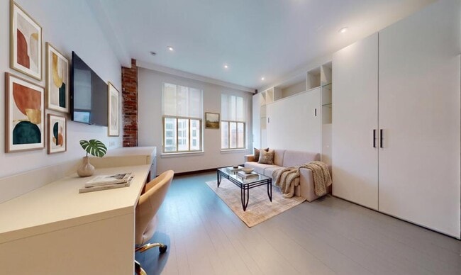 Building Photo - Spacious Furnished Studio in Prime Luxury Building