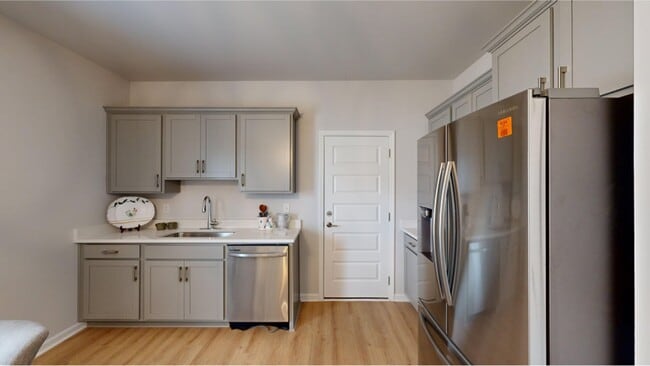 This kitchen showcases an elegant countertop for casual dining and new stainless steel appliances - 15747 Ruthie Lynn Dr Unit B