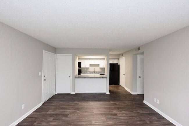 Spacious living room with hardwood-style flooring