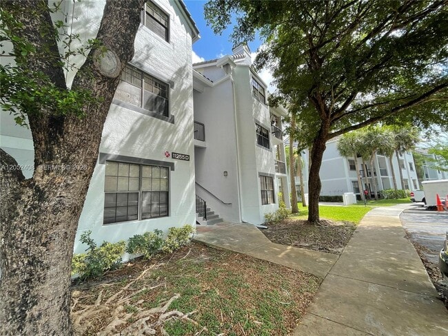 Building Photo - 11255 W Atlantic Blvd Unit 106
