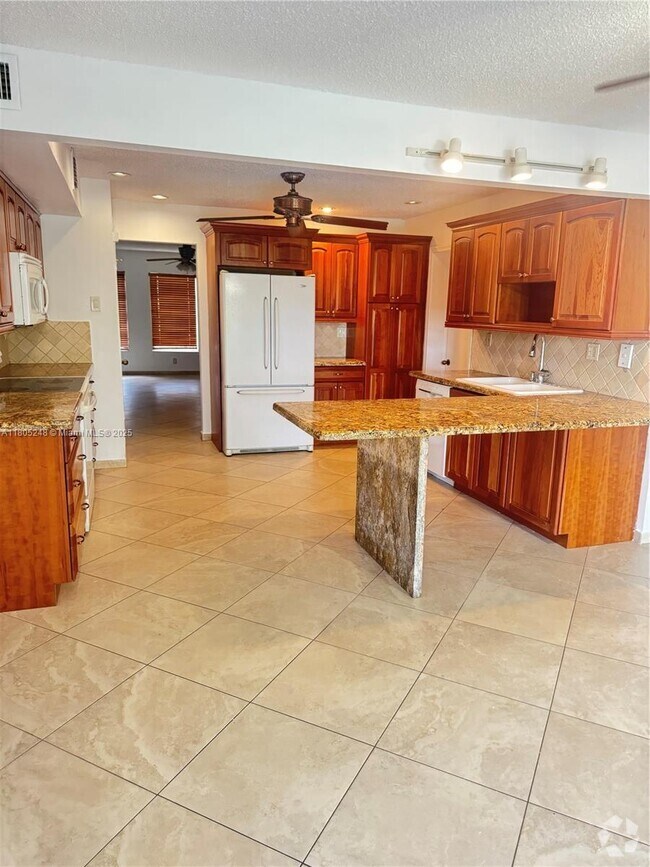 Building Photo - 3111 Coral Springs Dr Unit 215 Rental
