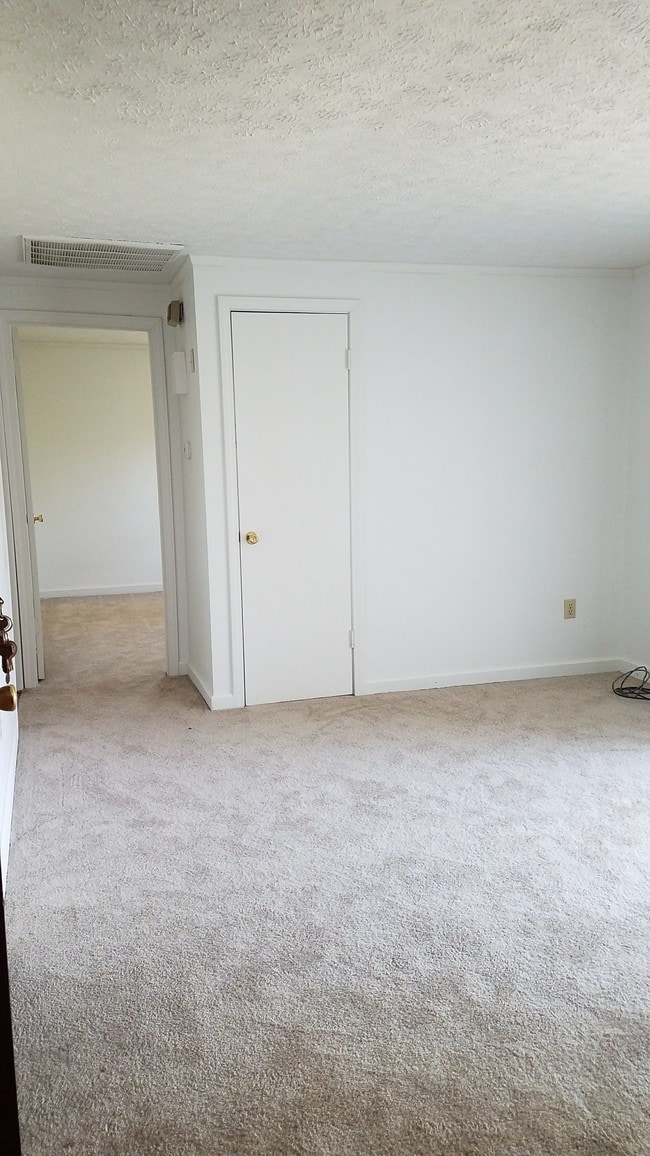 Living room looking into front bedroom
