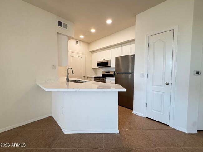 Building Photo - 1701 E Colter St Unit 185