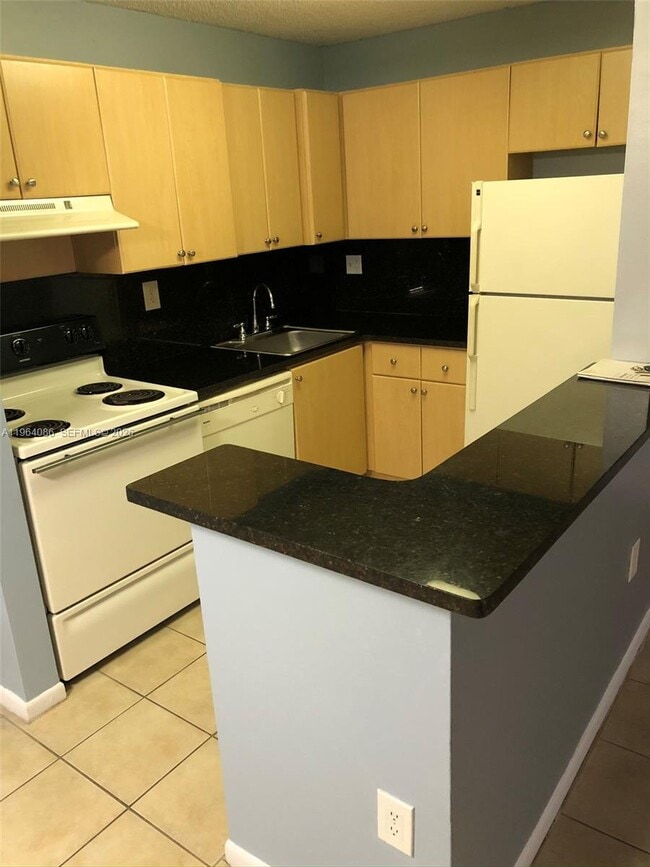 Building Photo - 7130 NW 179th St Unit 209