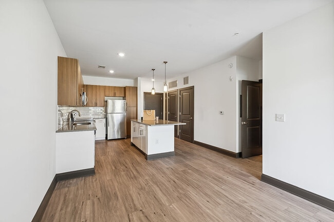 2BR, 2BA - 991SF B1 - Living Room and Kitchen - Millhouse Station