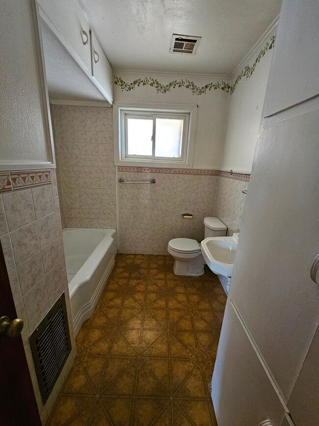 Photo - Property with a carport and laundry.