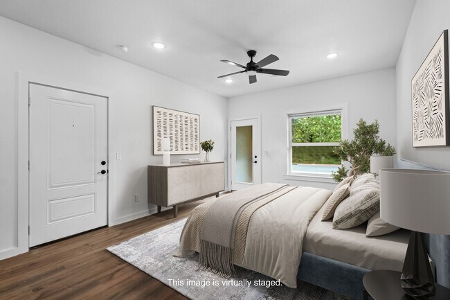 Bedroom with ceiling fan (virtually staged)