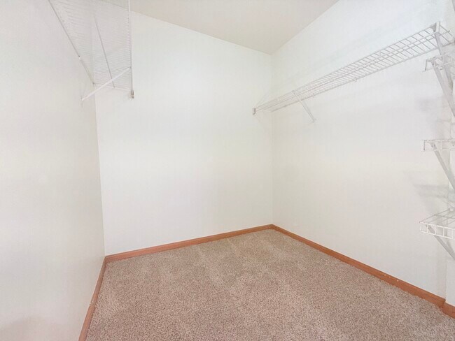 2-Bedroom apartment featuring walk-in closets in the primary bedroom.