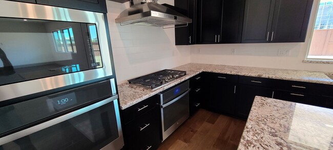 Photo - Stunning home with luxurious wood floor and beautiful spacious yard