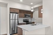 A contemporary kitchen design with sleek finishes and plenty of counter space.