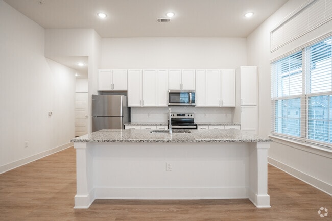 3BR, 2BA - 1,403SF - Kitchen - The Quincy Apartments