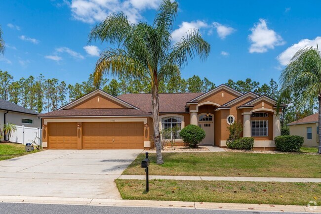 Building Photo - Spacious 4/3 Pool Home in the Gated Lake F...