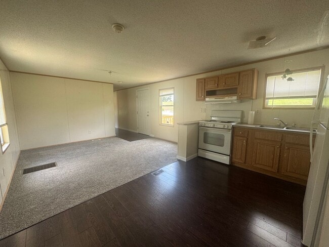Photo - Charming 3/1 Mobile Home in Quiet Park w/ Well, Septic, & Lawn Maintenance