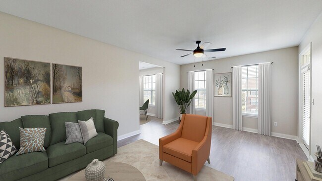 Sala de estar recientemente renovada con pisos estilo madera - Double Creek Flats Apartments