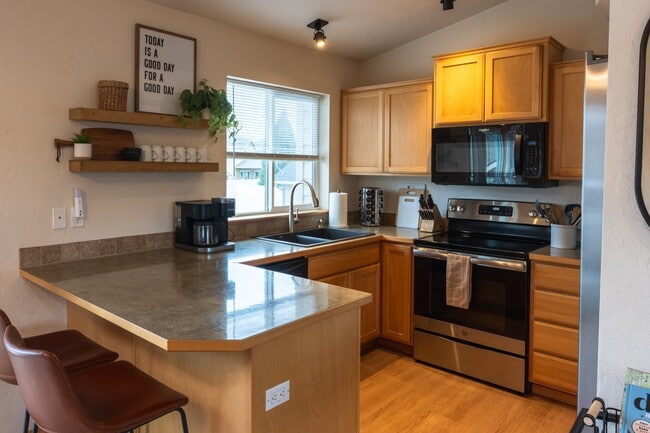 Kitchen - Clean and Cozy - New Delta Faucet and Whirlpool microwave - 2805 W Dumont Dr