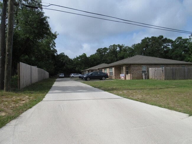 Building Photo - West Pensacola Duplex Living — 3BR Home with Open Floor Plan, Eat-In Kitchen, Covered Patio & Low... Unit C