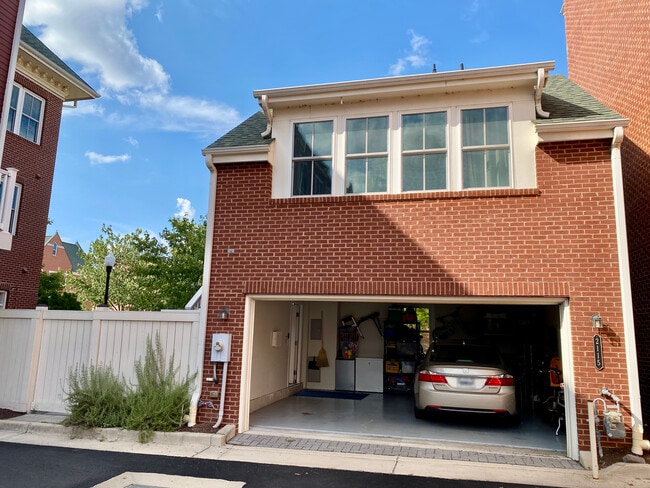 The unit sits above the detached garage with one parking space included.