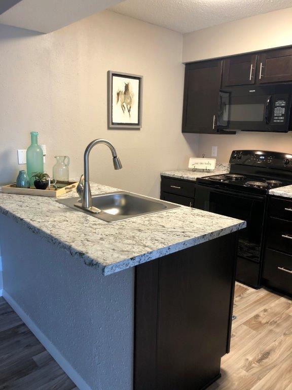 Renovated Kitchen - Brickstone at Woodlawn LLC Apartments