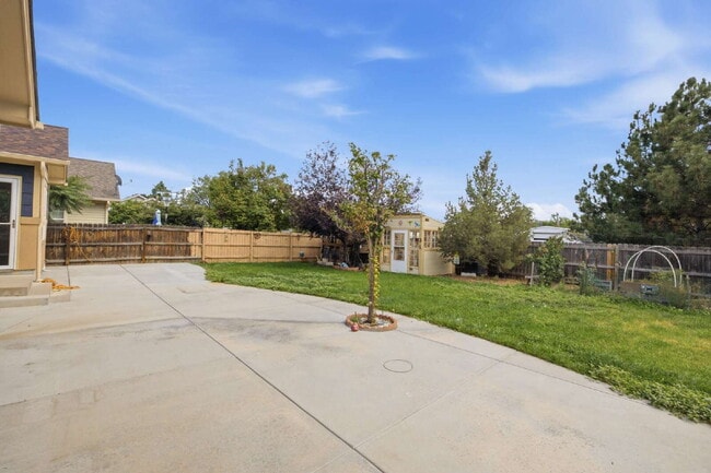Photo - Spacious 5-Bed Retreat with Modern Updates in Aurora. Included - Greenhouse and Shed!