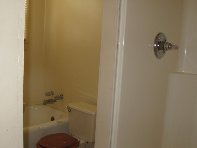 bathroom with tub and shower - 2203 Lee St