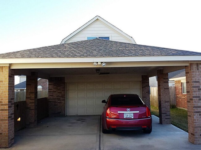 2 Car detached Garage with Covered Parking for 2 additional cars. 2 Story Storage (Man Cave/ Mother-law suite - unfinished at this time) - 11502 Grimes Ave. House