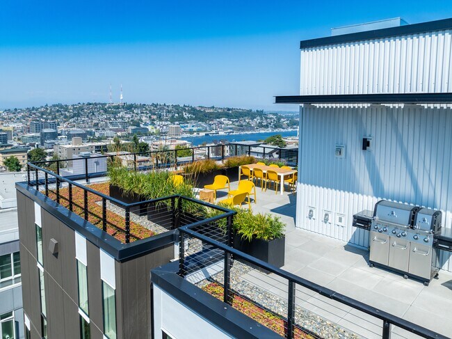 Enjoy the ciEnjoy the exterior rooftop view with seating and city view at Alt Capitol Hill.ty view from the rooftop patio with comfortable seating at Alt Capitol Hill.