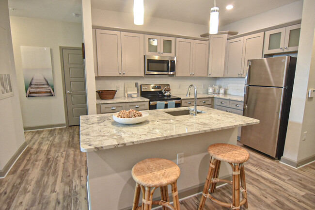 Spacious Kitchens with Wood-Inspired Flooring - Hawthorne at Smith Creek Apartments