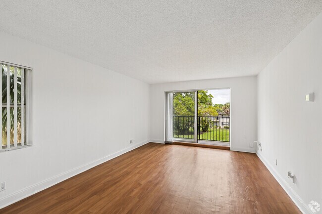The Peacock II - 2BR, 2BA - 850SF - Living Room - Plantation Gardens