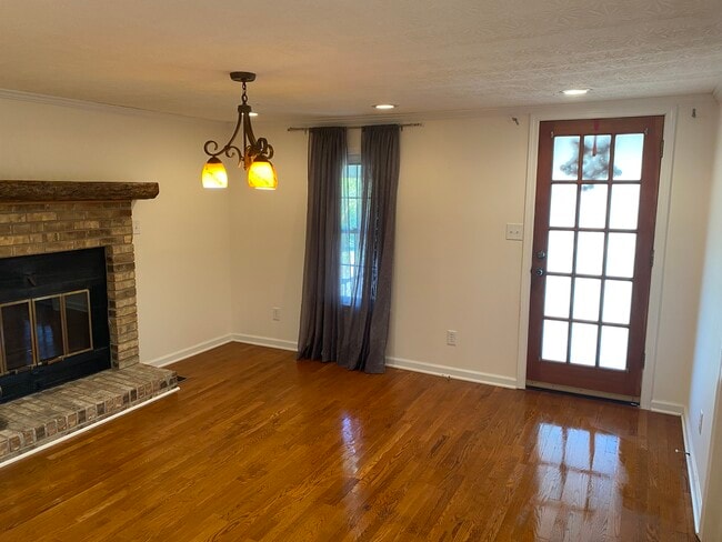 Front door entrance into Dining or Den with fireplace