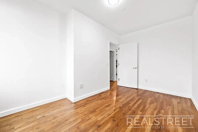 Photo - Modern 2-Bedroom Apartment with Private Balcony in Prime Bushwick Unidad 5A