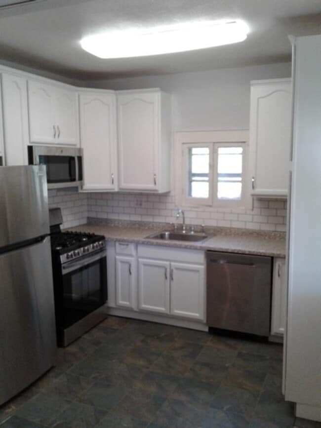 Photo - Beautiful 3 bed / 1 bath home on corner lot with attached garage in quiet Sparta neighborhood!