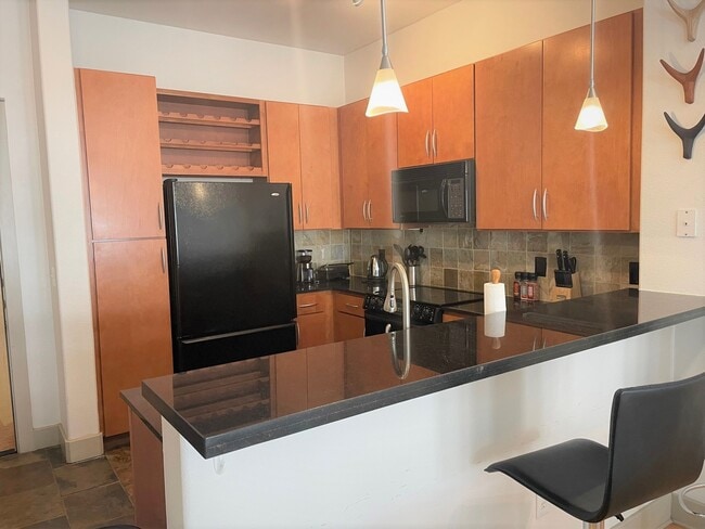Everything you need in a kitchen! Refrigerator, plates, glasses, silverware, small appliances.