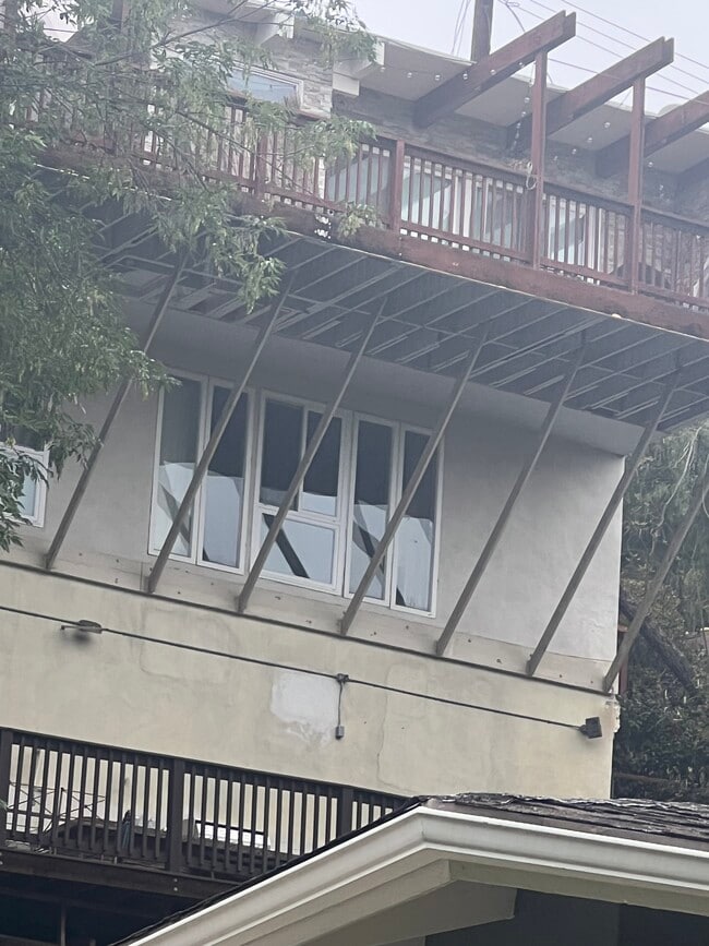 View of house from Distance. Rental unit is underneath the main house on top - 2300 Sunset Heights Dr Unit david younesi