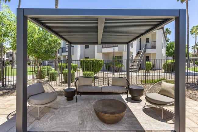 Comfortable outdoor seating by the pool - Boulders at Lookout Mountain Apartment Homes